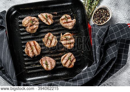 Tender Boneless Grilled Pork Chops. Steak Tenderloin. Gray Background. Top View