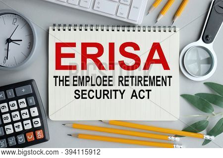 Page With Erisa The Employee Retirement Income Security Act, Text On Notebook On Gray Background