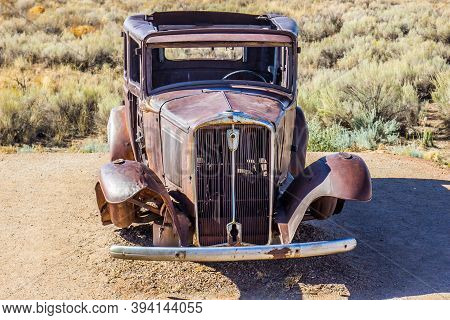 Old Rusty Automobile Abandoned In High Desert