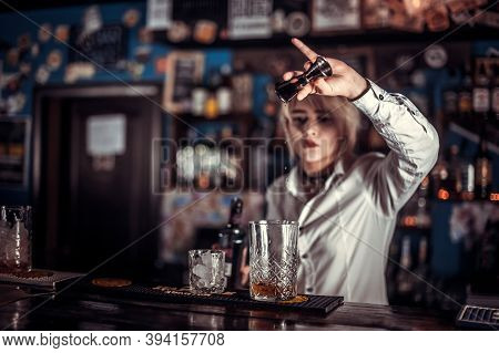 Portrait Of Girl Tapster Demonstrates His Professional Skills In The Nightclub