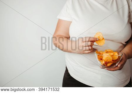 Processed Food, Unhealthy Diet, Imbalanced Ration. Overweight Woman Eating Salted Fattening Potato C
