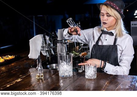 Girl Barman Makes A Cocktail On The Taproom