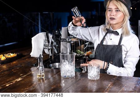 Experienced Girl Bartending Demonstrates His Professional Skills In The Night Club