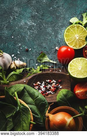 Fresh Helthy Food Cooking Vegetable Ingredients On Dark Background With Rustic Wooden Board. Diet Or