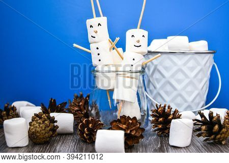 Two Happy Funny Marshmallow Snowmen. Marshmallow Friends On Blue Background. Diy. Sweet Treat For Ki