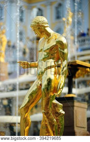 A Golden Statue At Lower Garden In Peterhof Palace, Saint Petersburg, Russia. The Peterhof Museum Is