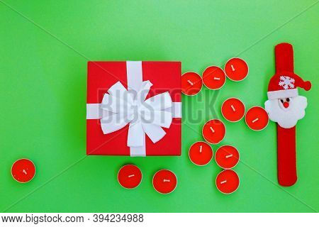 Christmas Composition. Christmas Gift, Presrnt Box And Many Red Candles Top View, Flat Lay.