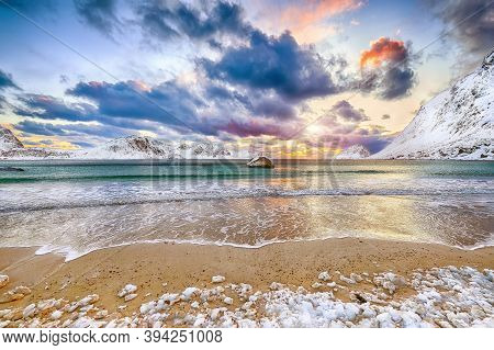 Splendid Winter Scenery With Haukland Beach During Sunset And Snowy  Mountain Peaks Near Leknes.  Lo