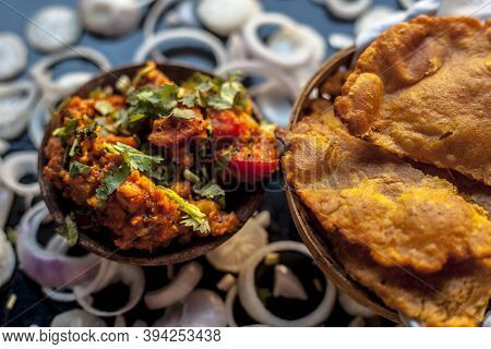Close Up Shot Of Batate Ki Sukhi Bhaji Or Potato Sabji In A Clay Bowl Along With Some Dry Plain Frie