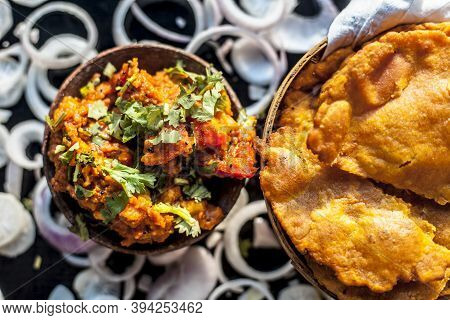 Close Up Shot Of Batate Ki Sukhi Bhaji Or Potato Sabji In A Clay Bowl Along With Some Dry Plain Frie