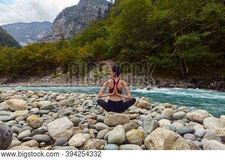 Yoga Classes In Nature. The Concept Of Playing Sports Alone. Social Exclusion. A Woman Does Yoga On 