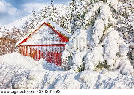 Stunning Winter Scenery With Traditional Norwegian Red Wooden Houses On Valberg Village At Lofotens.