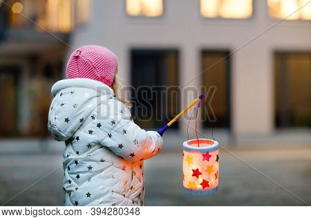 Little Kid Girl Holding Selfmade Lanterns With Candle For St. Martin Procession. Healthy Cute Toddle