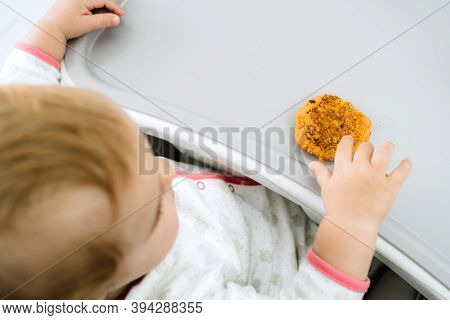 Baby Eating With His Hands At Early Stages Of Baby Led Weaning