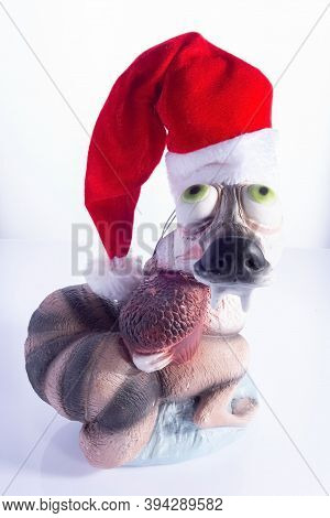 Krivoy Rog. Ukraine. November 2020. Ice Age Cartoon Squirrel Holding A Nut In Santa Hat Isolated On 
