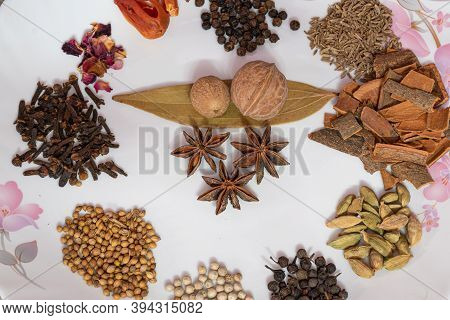 Different Spices And Herbs In A Plate, Close Up, Top View. Assortment Colorful Spices, Seeds And Her