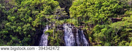 Beautiful Panoramic View Of Opaekaa Waterfalls In Hawaii, Island Of Kauai. Lush Green Tropical Fores