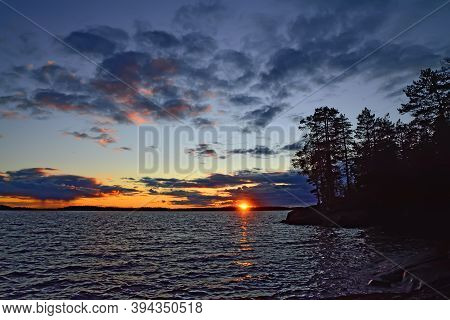 Dramatic Northern Sunset In Purple Tones. Lake Keret, North Karelia, Russia