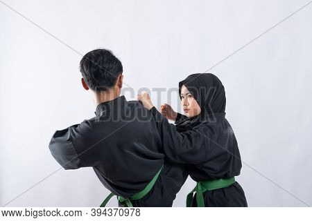 Two Fighters In Pencak Silat Hitam Uniform Fight In A Push