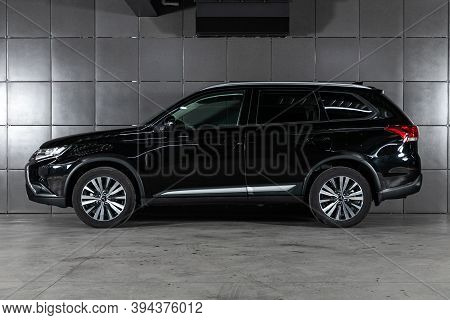 Novosibirsk, Russia - October 26, 2020: Black Mitsubishi Outlander, Side  View.  New Crossover Made 