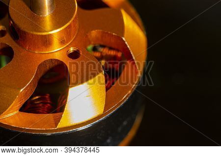 Brushless Motor (bldc) For Aircraft Model Close-up On A Black Background. Selective Focus.