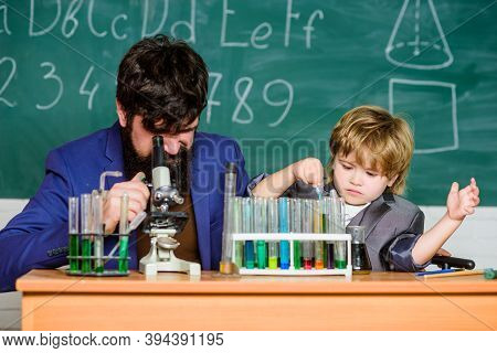 My Father Is Scientist. Teacher Bearded Man Father And Child Test Tubes. Study Chemistry Together. B