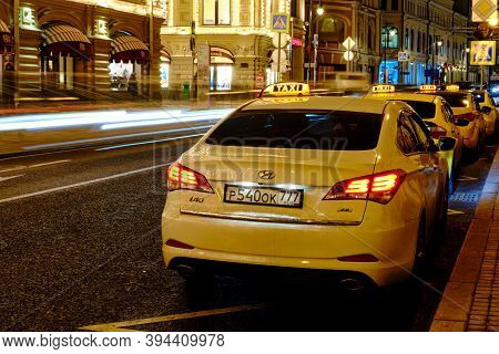 Taxis Stand On The Night Streets Of The City In The Center Of Moscow. Evening Street Near The Kremli