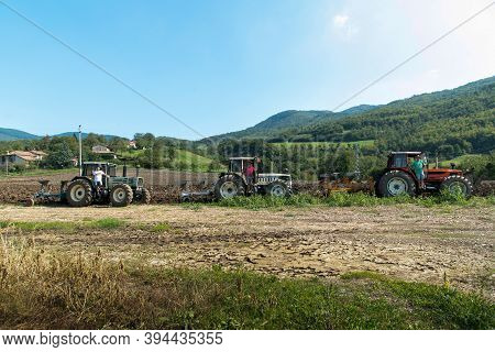 September 2020, Calestano Province Of Parma, Italy. Three Tractors Plowing A Field. Same Galaxy 170.