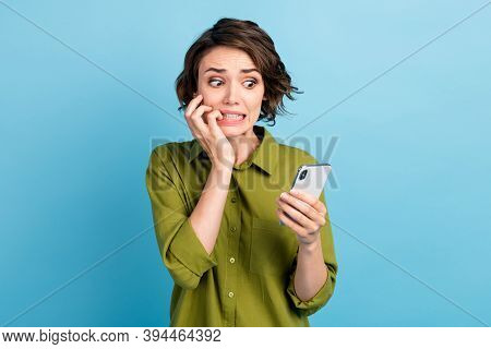 Photo Of Horrified Lovely Lady Short Hairdo Arms Hold Telephone Gnaw Bite Nail Horrified Look Screen