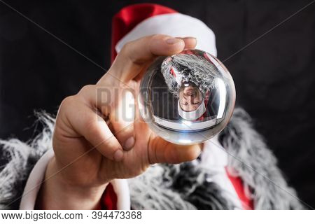 Cheerful Santa Dressed In Fur Skin With Crystal Spehre