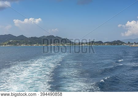 Seascape. Trail On The Sea From The Boat On The Background Of The Coastline. Stock Photo