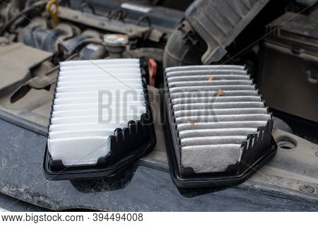 Replacing The Car Engine Air Filter. The Photo Shows An Old Dirty Filter And A New One. The Filters 