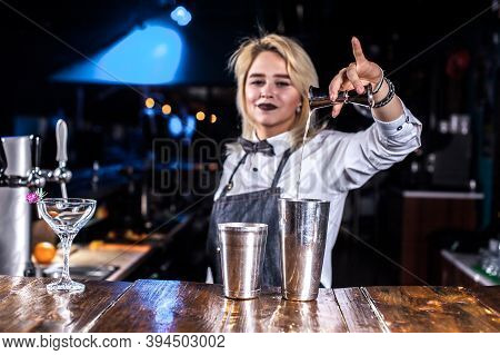 Girl Bartender Makes A Cocktail On The Saloon