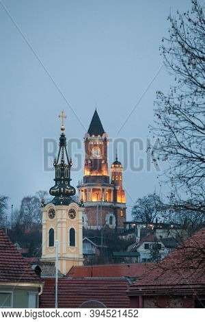 Gardos Tower And The Church Of The Holy Virgin At Night In Zemun, Belgrade, Serbia. Also Called Kula