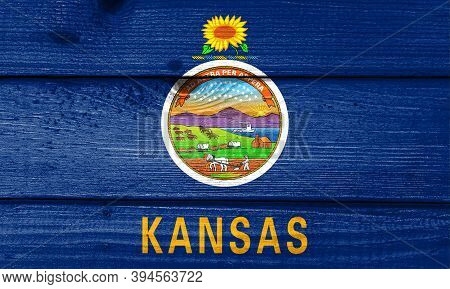 Kansas Flag Painted On Old Wood Plank Background. Brushed Natural Light Knotted Wooden Board Texture
