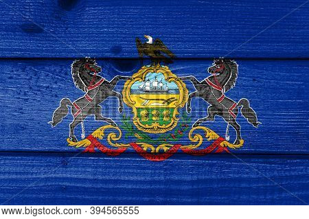 Pennsylvania Flag Painted On Old Wood Plank Background. Brushed Natural Light Knotted Wooden Board T