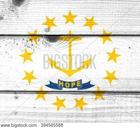 Rhode Island Flag Painted On Old Wood Plank Background. Brushed Natural Light Knotted Wooden Board T