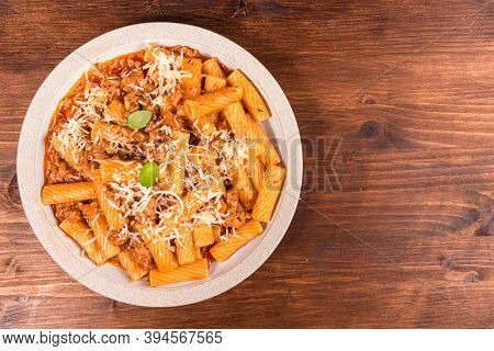 Cooking Tortiglioni With Onion And Sausage Ragout, Pasta With Sausage Sauce With Onions And Tomato P