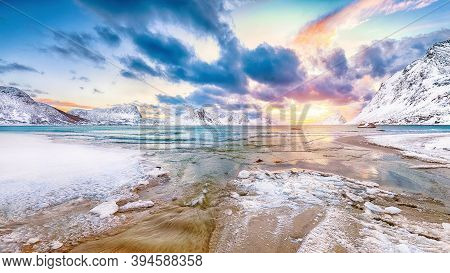 Splendid Winter Scenery With Haukland Beach During Sunset And Snowy  Mountain Peaks Near Leknes.  Lo