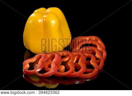 Sweet Siliculose Pepper. Yellow Vegetable Is Isolated On A Black Background. With Break Of A Way. Al