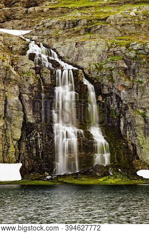 Mountain Lake Flotvatnet With Waterfall. Scenic Region Between Aurland And Laerdal In Norway. Nation