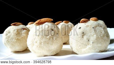 Tasty Rice Laddus In White Plate Garnished With Dry Fruits In India