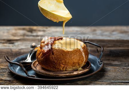 Delicious Cream Soup With Bacon Serve In Bread On Table. Diet Fresh Food Meal Dish Soup Lunch On A R