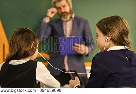 Instead Studying. School Students And Teacher. Addicted To Internet Online Games. Compliance With Sc