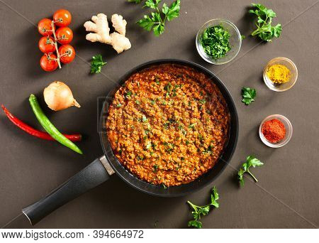 Keema Curry In Frying Pan Over Dark Background. Indian And Pakistani Style Dish. Top View, Flat Lay,