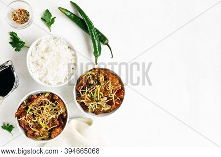 Spicy Garlic Fried Chicken (kkanpunggi). Asian Chicken In Sweet And Sour Sauce In Bowl Over White Ba
