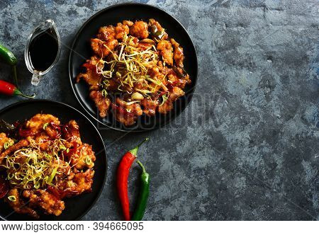 Spicy Garlic Fried Chicken (kkanpunggi). Asian Chicken In Sweet And Sour Sauce On Plate Over Dark St