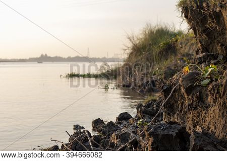 Riverbank Erosion From Floodwater Close Up Shot Beside The River