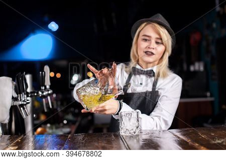 Girl Bartender Creates A Cocktail In The Public House