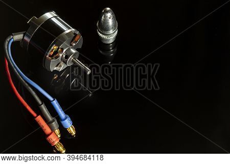 Aircraft Model Brushless (bldc) Outrunner 3-phase Motor With Propeller Adapter On A Black Background